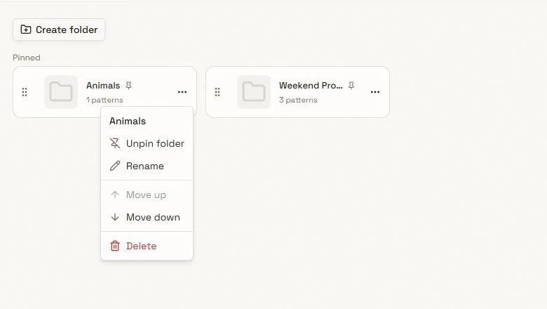 Close-up of Pinned folders with Create folder, drag handles, and an open folder actions menu.